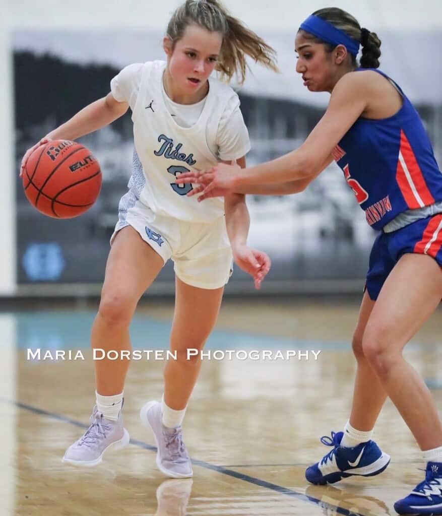 Taylor Schwab gets hand-checked by an Auburn Mountainview defender.