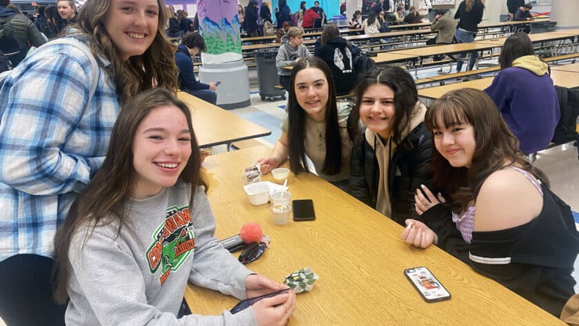 Students at Gig Harbor High School go without masks on Monday, March 14, 2022, the first day of school since Gov. Jay Inslee lifted the state’s indoor mask mandate. Pictured, from left, are Lola Hawkins, Courtney Myers, Emma Vandervort, Adrien Collier and Adrienne Anderson, all sophomores.