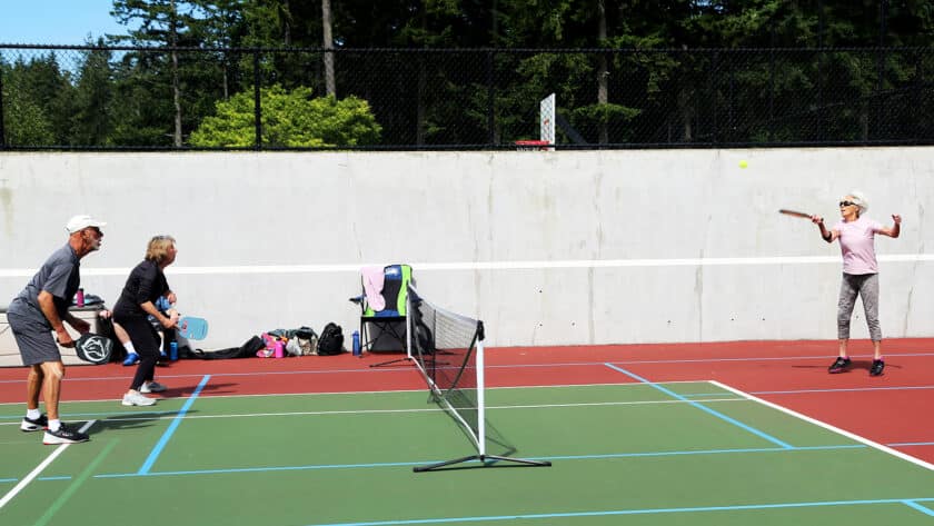 Pickleball games take over the tennis courts at Sehmel Homestead Park most mornings.