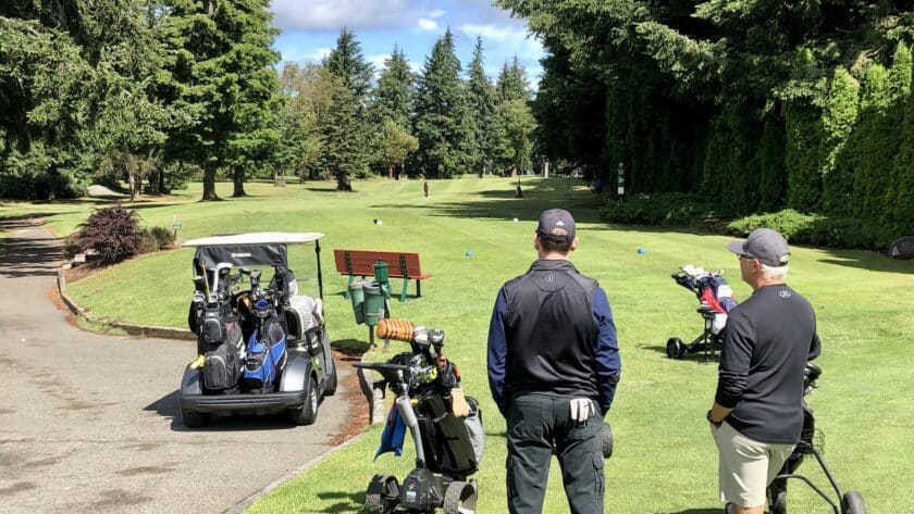 Golfers waiting to tee off at Madrona Links Golf Course.