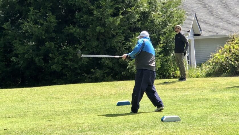 A golfer tees off at Madrona Links Saturday.