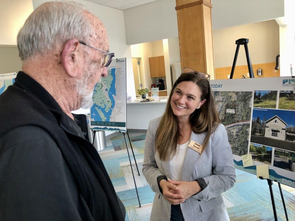 Consultant Sarah Singleton Schroedel speaks with Frank Hassell who wants to see more pickleball courts in the area.